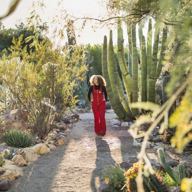 Photograph of girl in cactus garden