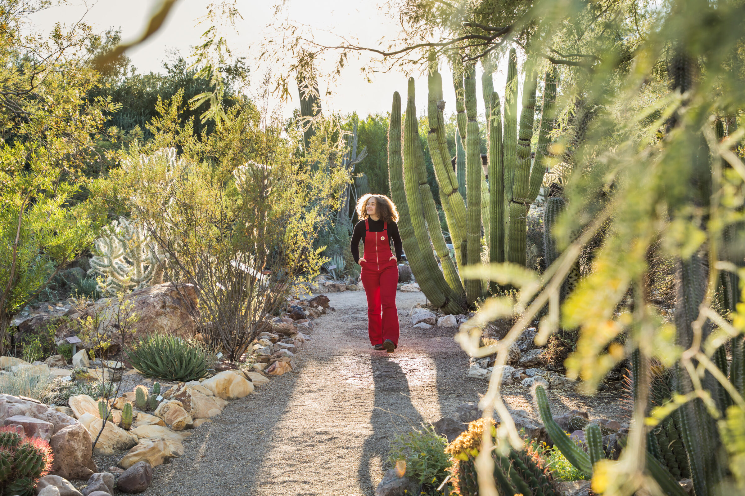 Photograph of girl in cactus garden