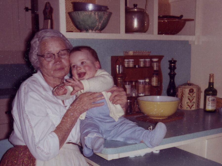 Photograph of Edna with a baby